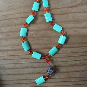 Green stone necklace with orange beads